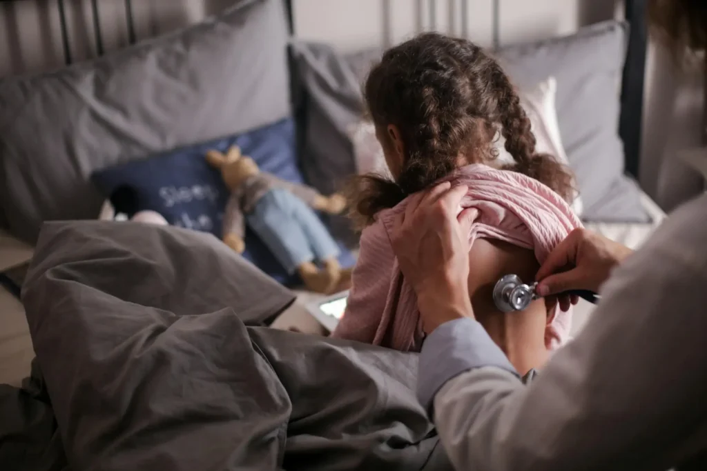 Child getting checked up by doctor